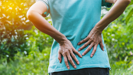 Man holding his lower back in pain
